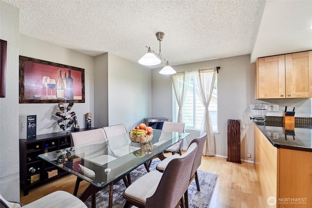 2003 SW 307th St Unit B, Federal Way, WA 98023 - dining room featuring light wood-type flooring and a textured ceiling