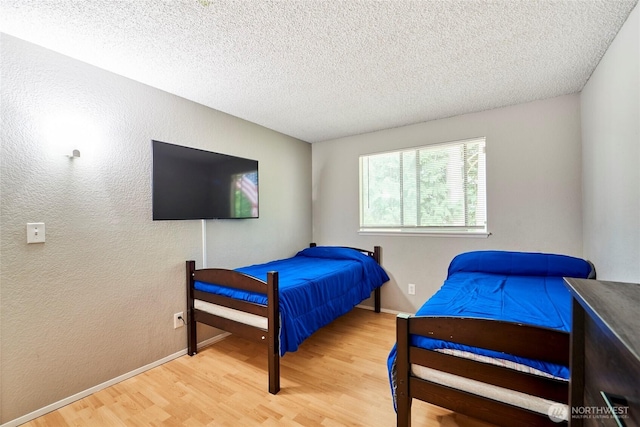 2003 SW 307th St Unit B, Federal Way, WA 98023 - bedroom featuring wood finished floors and a textured ceiling