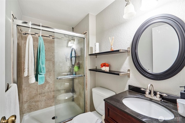 2003 SW 307th St Unit B, Federal Way, WA 98023 - bathroom featuring a textured wall, vanity, and a stall shower