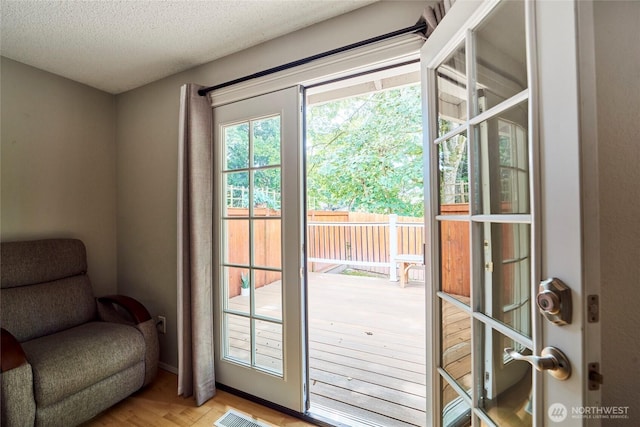 2003 SW 307th St Unit B, Federal Way, WA 98023 - doorway with a textured ceiling and light wood-style floors