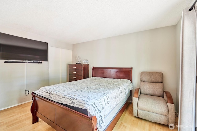 2003 SW 307th St Unit B, Federal Way, WA 98023 - bedroom with light wood-style flooring and a closet