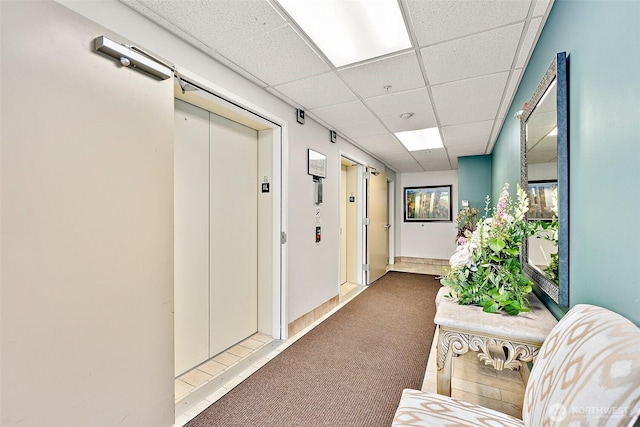 3201 Pacific Ave Unit 602, Tacoma, WA 98418 - corridor with carpet, a drop ceiling, and a barn door