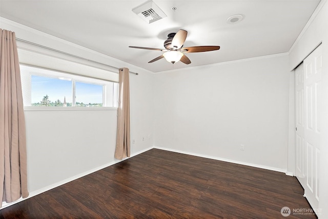 3201 Pacific Ave Unit 602, Tacoma, WA 98418 - unfurnished bedroom with a closet, dark wood-style floors, crown molding, and a ceiling fan
