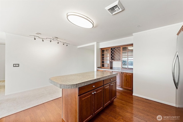 3201 Pacific Ave Unit 602, Tacoma, WA 98418 - kitchen with dark wood-type flooring, a kitchen island, and open shelves