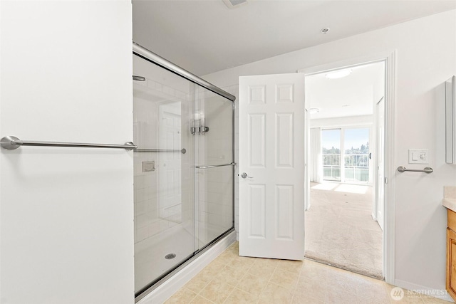 3201 Pacific Ave Unit 602, Tacoma, WA 98418 - bathroom with a stall shower, vanity, and tile patterned floors