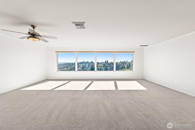 3201 Pacific Ave Unit 602, Tacoma, WA 98418 - empty room with healthy amount of natural light, crown molding, carpet floors, and ceiling fan