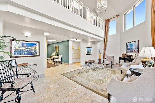 3201 Pacific Ave Unit 602, Tacoma, WA 98418 - living room with a high ceiling and a chandelier