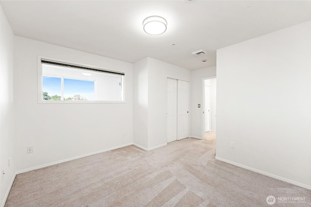 3201 Pacific Ave Unit 602, Tacoma, WA 98418 - unfurnished bedroom featuring carpet floors and a closet