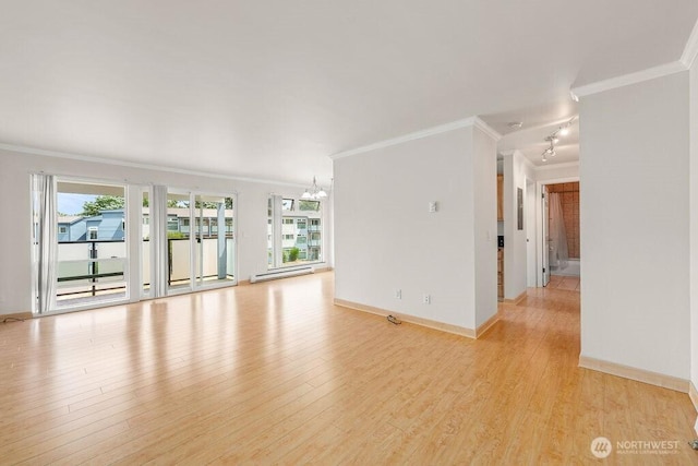 15146 65th Ave S Unit 518, Tukwila, WA 98188 - unfurnished room with crown molding, a chandelier, light wood-style floors, and a baseboard heating unit