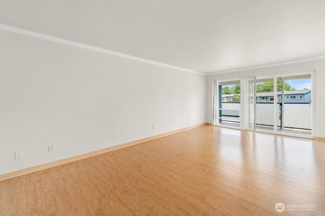 15146 65th Ave S Unit 518, Tukwila, WA 98188 - spare room featuring crown molding and wood finished floors