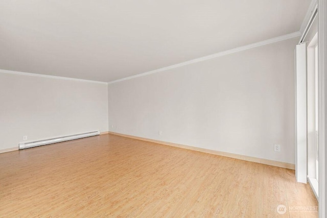 15146 65th Ave S Unit 518, Tukwila, WA 98188 - empty room featuring a baseboard radiator, wood finished floors, and crown molding