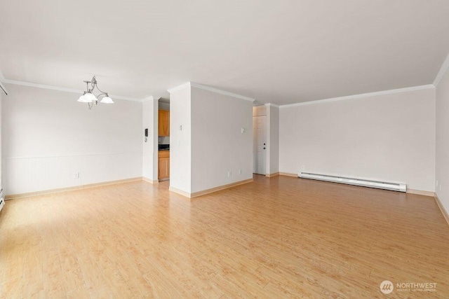 15146 65th Ave S Unit 518, Tukwila, WA 98188 - empty room featuring a baseboard heating unit, ornamental molding, light wood-style flooring, and a chandelier