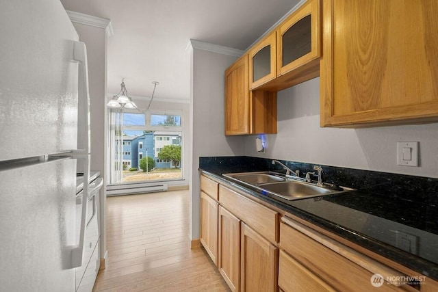 15146 65th Ave S Unit 518, Tukwila, WA 98188 - kitchen with freestanding refrigerator, ornamental molding, baseboard heating, glass insert cabinets, and light wood-style floors
