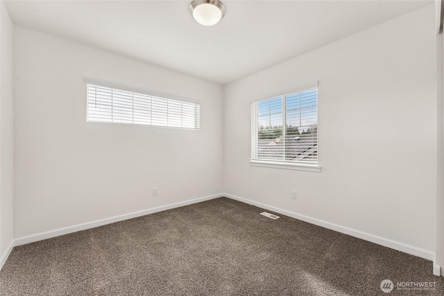 14756 88th Way SE Unit 10, Yelm, WA 98597 - unfurnished room featuring dark colored carpet and baseboards