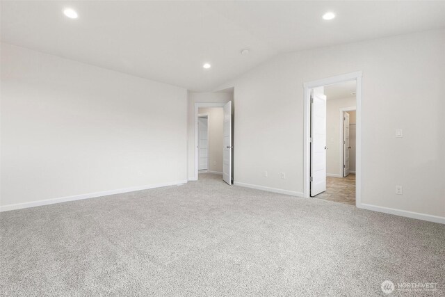 14756 88th Way SE Unit 10, Yelm, WA 98597 - unfurnished bedroom featuring light colored carpet, recessed lighting, and lofted ceiling