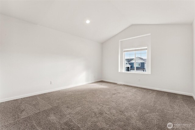 14756 88th Way SE Unit 10, Yelm, WA 98597 - unfurnished room featuring vaulted ceiling and carpet floors