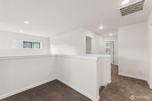 14756 88th Way SE Unit 10, Yelm, WA 98597 - hall with dark carpet, an upstairs landing, and recessed lighting