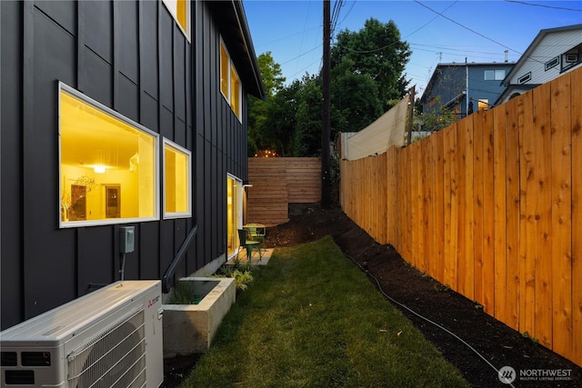 2616 E Roy St, Seattle, WA 98112 - view of side of property featuring board and batten siding and a cooling unit