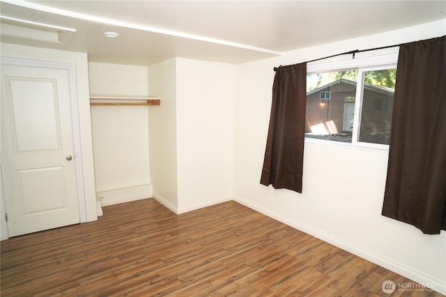 4011 147th Pl SE, Bellevue, WA 98006 - unfurnished bedroom with wood finished floors and a closet