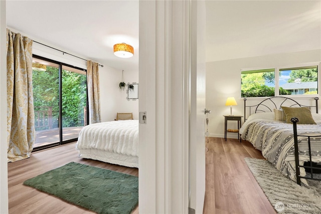 10507 NE 193rd St, Bothell, WA 98011 - bedroom featuring access to outside and wood finished floors