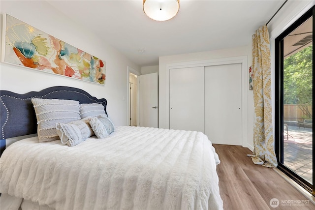 10507 NE 193rd St, Bothell, WA 98011 - bedroom with wood finished floors, a closet, and access to exterior