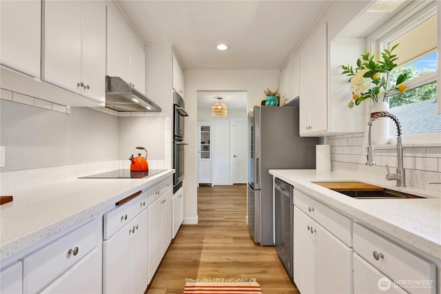 10507 NE 193rd St, Bothell, WA 98011 - kitchen featuring under cabinet range hood, white cabinets, stainless steel appliances, and recessed lighting