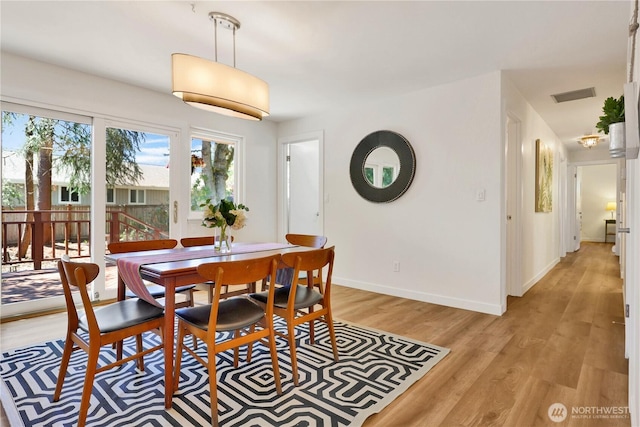 10507 NE 193rd St, Bothell, WA 98011 - dining space with light wood-style flooring and baseboards