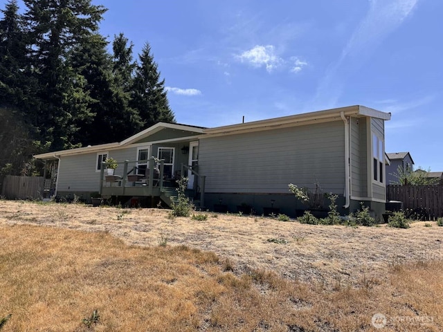 8839 Daffodil Ln SE, Olympia, WA 98513 - manufactured / mobile home featuring a wooden deck