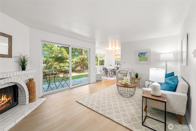 12504 NE 142nd Ln Unit C102, Kirkland, WA 98034 - living area with wood finished floors and a fireplace
