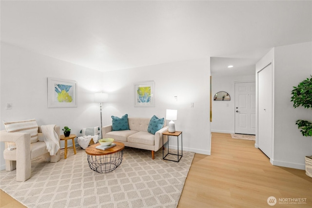 12504 NE 142nd Ln Unit C102, Kirkland, WA 98034 - living room featuring light wood finished floors and recessed lighting