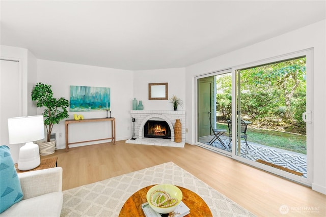12504 NE 142nd Ln Unit C102, Kirkland, WA 98034 - living area featuring wood finished floors and a fireplace