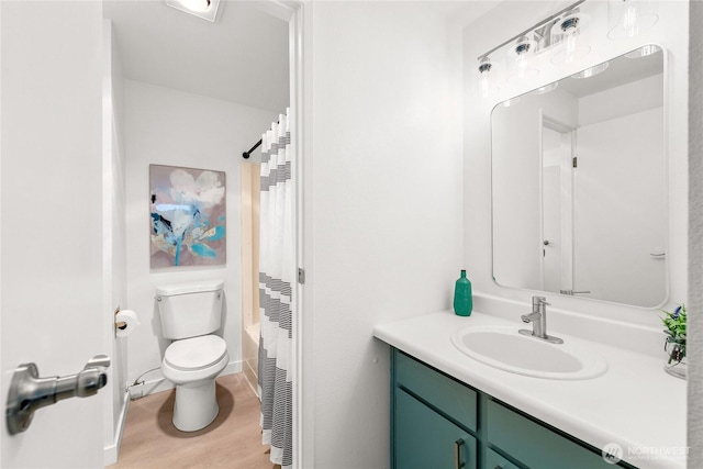 12504 NE 142nd Ln Unit C102, Kirkland, WA 98034 - full bathroom featuring vanity, wood finished floors, and shower / bath combination with curtain