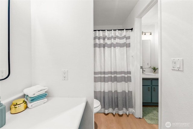 12504 NE 142nd Ln Unit C102, Kirkland, WA 98034 - full bath with wood finished floors, vanity, and a shower with curtain