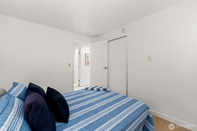 12504 NE 142nd Ln Unit C102, Kirkland, WA 98034 - bedroom with wood finished floors and a closet