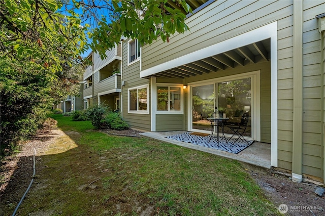 12504 NE 142nd Ln Unit C102, Kirkland, WA 98034 - view of green lawn with a patio