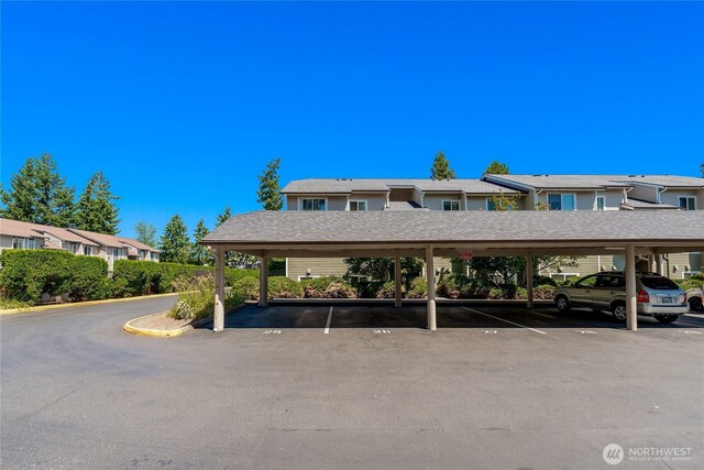 12504 NE 142nd Ln Unit C102, Kirkland, WA 98034 - covered parking lot with a residential view