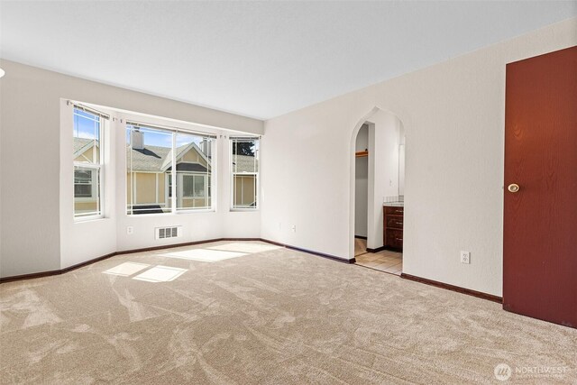 2621 Mountain View Ave W Unit 5B, Tacoma, WA 98466 - spare room with carpet flooring and arched walkways