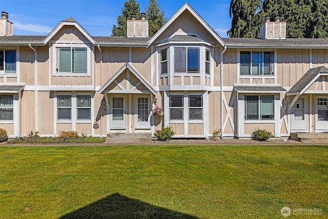 2621 Mountain View Ave W Unit 5B, Tacoma, WA 98466 - townhome / multi-family property with a chimney, a front yard, and board and batten siding