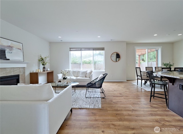 16271 SE 181st St, Renton, WA 98058 - living area featuring light wood-type flooring, recessed lighting, and a fireplace