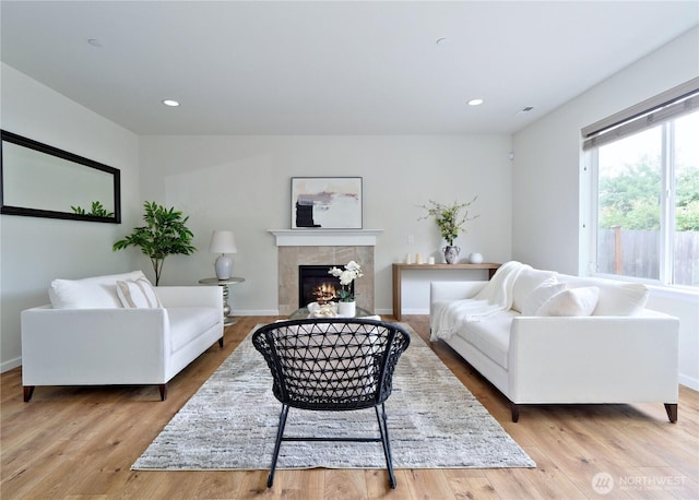 16271 SE 181st St, Renton, WA 98058 - living area featuring a tile fireplace, wood finished floors, and recessed lighting