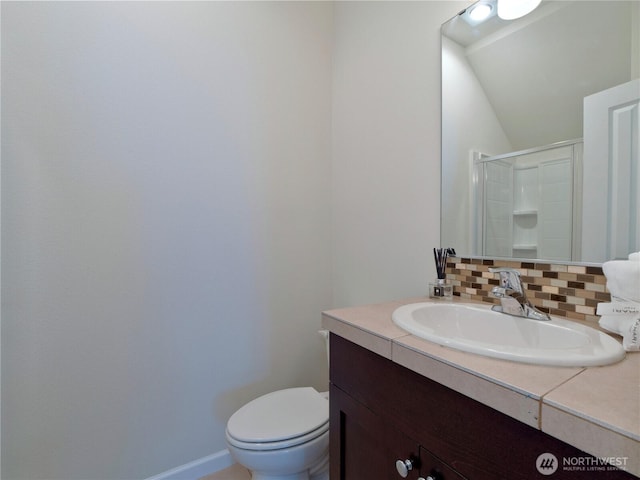 16271 SE 181st St, Renton, WA 98058 - bathroom with backsplash, vanity, lofted ceiling, and a shower with door