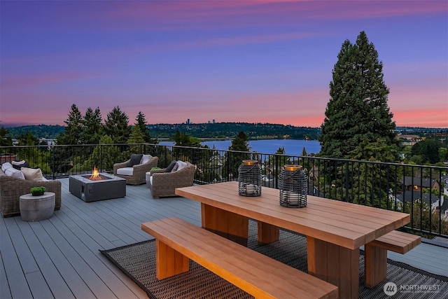 3865 46th Ave NE, Seattle, WA 98105 - deck at dusk with an outdoor fire pit and a water view