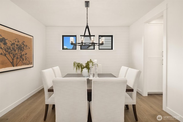 3865 46th Ave NE, Seattle, WA 98105 - dining room featuring wood finished floors and a chandelier