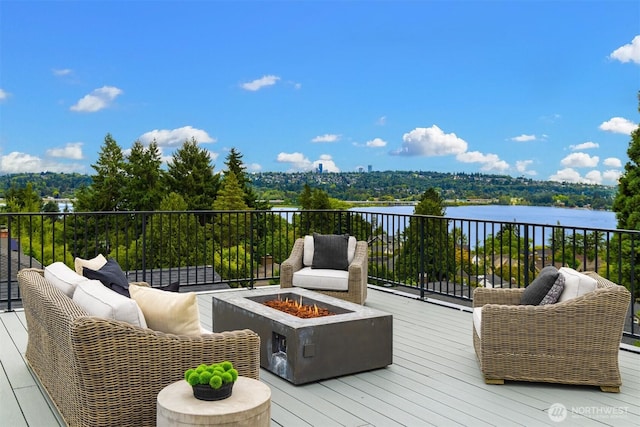 3865 46th Ave NE, Seattle, WA 98105 - wooden deck featuring a fire pit and a water view
