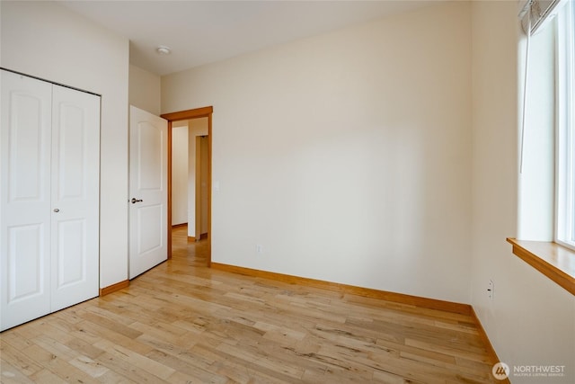 4824 Willow Dr, Blaine, WA 98230 - unfurnished bedroom featuring light wood-style flooring and a closet