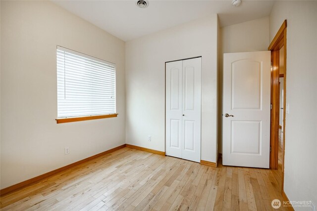 4824 Willow Dr, Blaine, WA 98230 - unfurnished bedroom featuring light wood finished floors and a closet