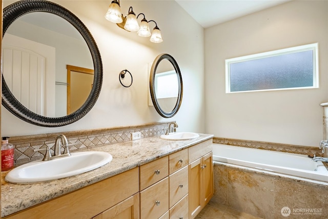 4824 Willow Dr, Blaine, WA 98230 - full bathroom with double vanity, a garden tub, and decorative backsplash