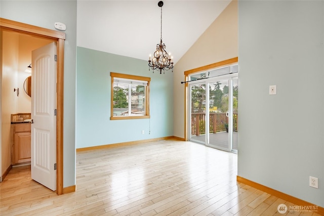 4824 Willow Dr, Blaine, WA 98230 - unfurnished room with a chandelier, light wood finished floors, and lofted ceiling