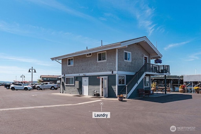 1600 5th St Unit D-162, Anacortes, WA 98221 - view of building exterior with stairs and uncovered parking