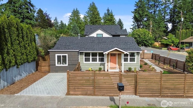 12302 5th Ave NE, Seattle, WA 98125 - bungalow-style house with a fenced front yard and a shingled roof